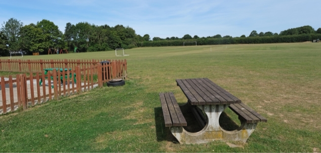 Sports Field with bench in foreground