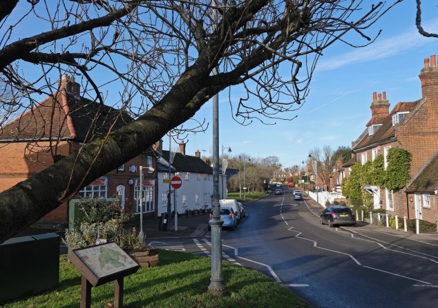 View 9 From Pond House looking north-west along High Street - long view from the village green along High Street going north out of the village with old houses on both sides of the road