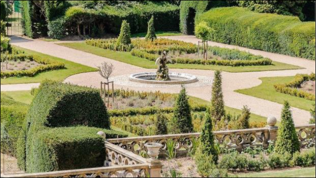 Gardens at The Node laid out in Italianate style with fountain and statue centre picture